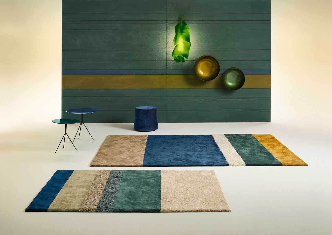 Two striped miroo Stripe rugs in teal, blue and ochre